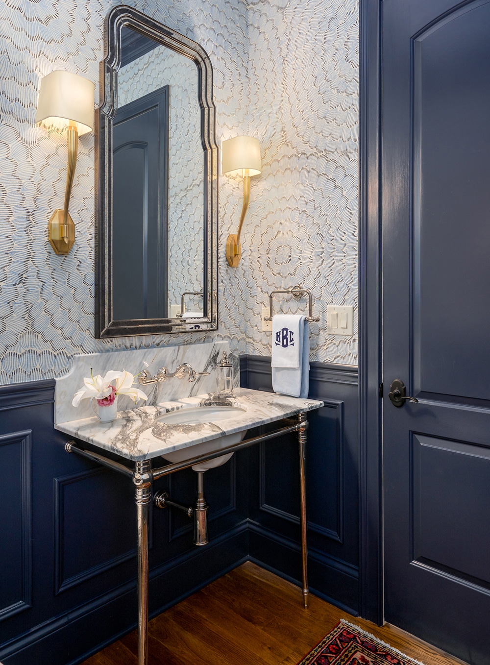 Laney Reusch Interior Design - Cincinnati Interior Designer - white and smokey blue powder room with detailed wall coverings and gold light fixtures