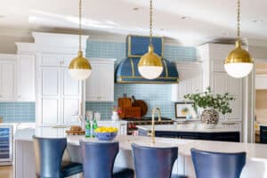Laney Reusch Interior Design - Cincinnati Interior Designer - gourmet kitchen with navy and gold range hood