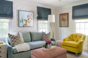 Hyde Park Interior Design Bedroom with light blue couch, yellow chair, and pink